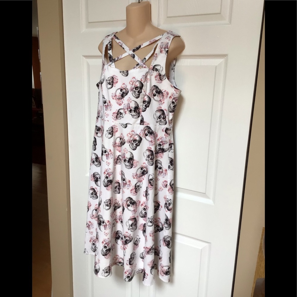 Torrid white with pink roses black skull dress.